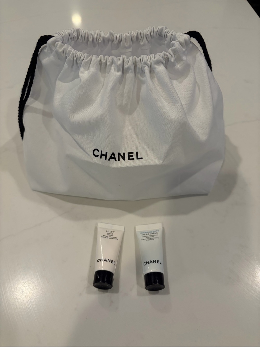 CHANEL White Drawstring Cosmetic Pouch with Skincare Tubes